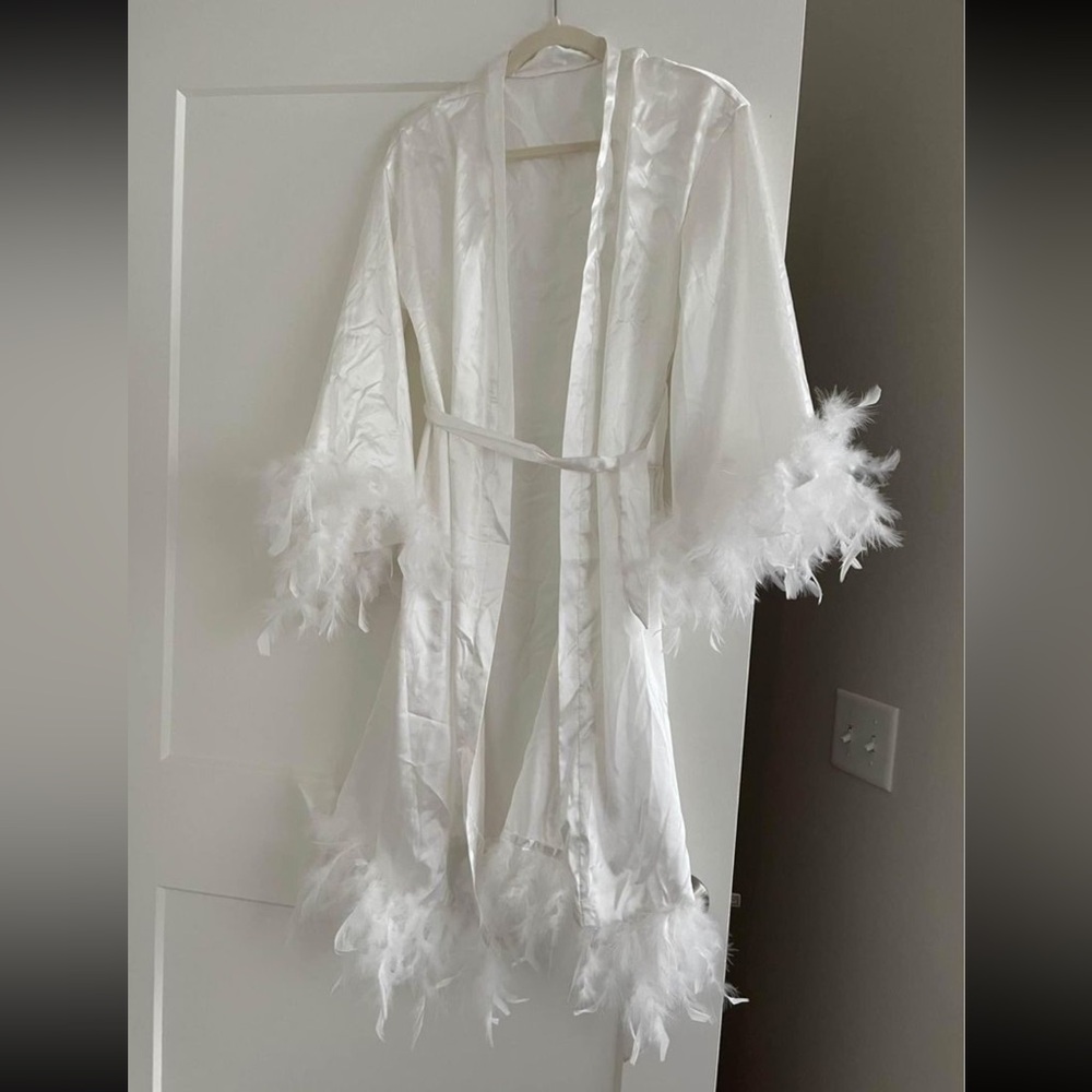 White silk bridal robe with feathered sleeves